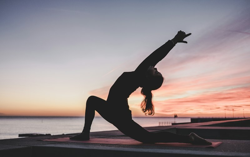 Focused yoga practitioner in a balanced mindful pose
