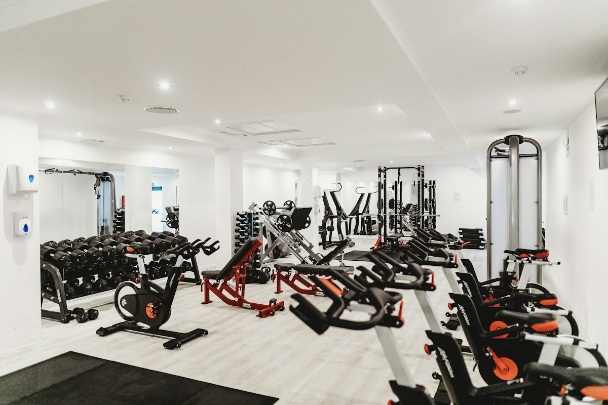 Commercial multi-station cable crossover tower and selectorized gym machines